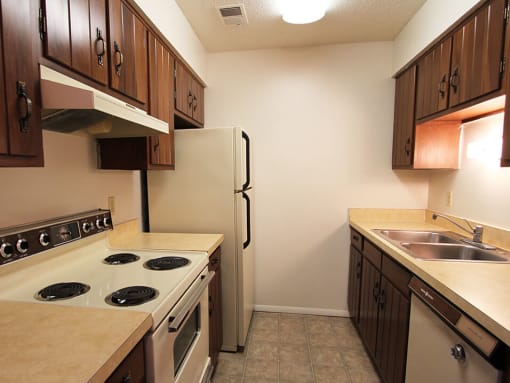 Apartment kitchen with oven and refrigerator