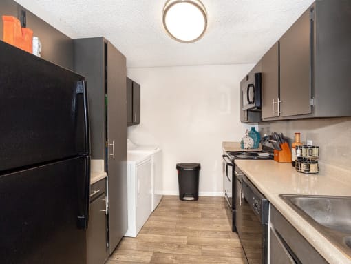 Kitchen with storage area at acadian point apartments