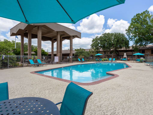 beautiful lounge area by pool at acadian point apartments
