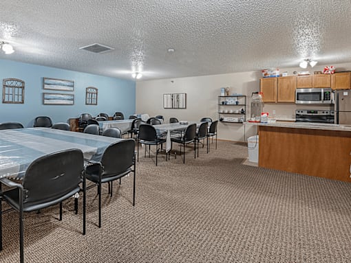 A room with a table and chairs in it.