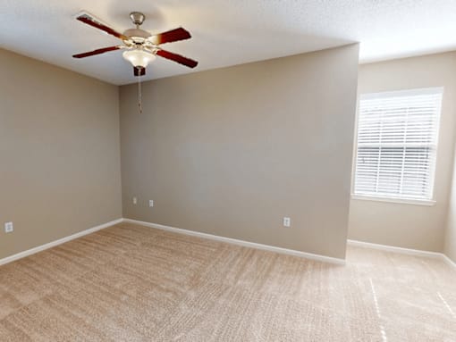 apartment bedroom with ceiling fan