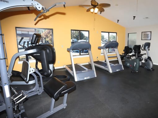gym area with treadmills, weight machines, and more
