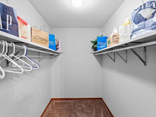 our spacious closet has shelves and hangers for clothes