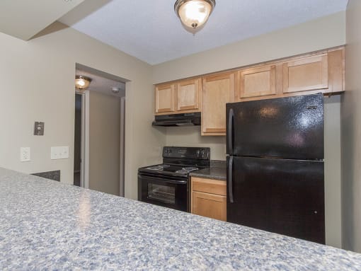 Kitchen with oven, refrigerator, and dishwasher
