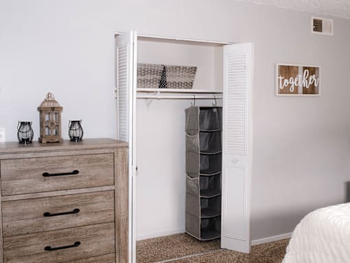 A white closet with a sign that says