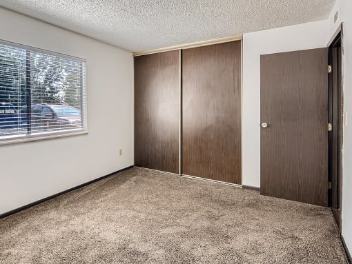 bedroom with connected closet at country green apartments