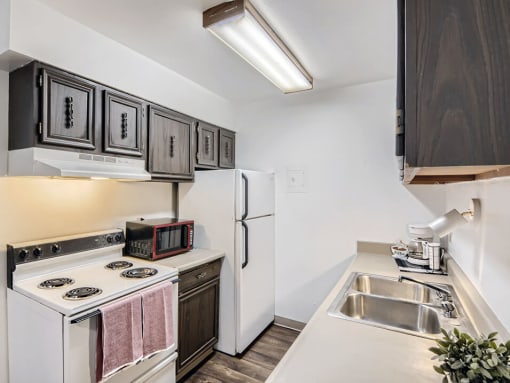 kitchen with storage space at country green apartments