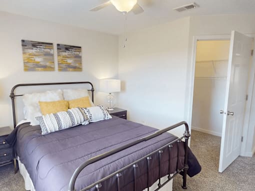 a bedroom with a bed and a closet