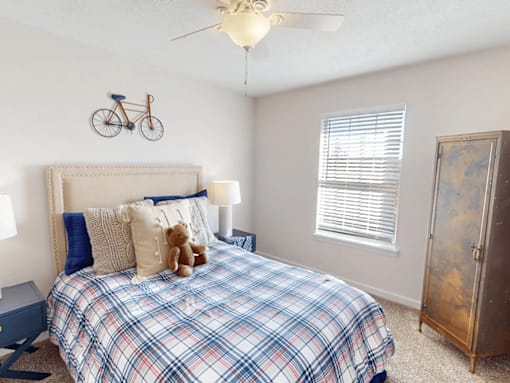 a bedroom with a bed and a bike on the wall