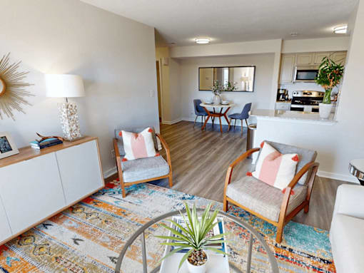 a living room with two chairs and a table