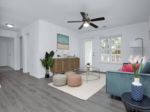 Apartment living room with a ceiling fan.
