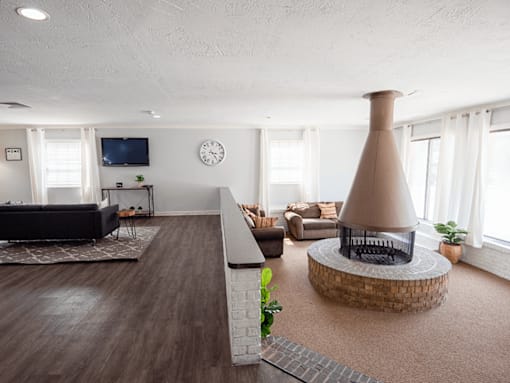 A living room with a fireplace and a couch.