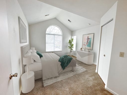 a bedroom with a bed and a bathtub