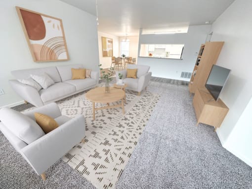 a living room with couches and a coffee table