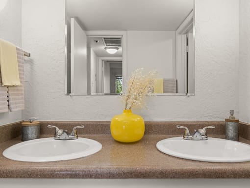dual sink vanity area in apartment in Albuquerque