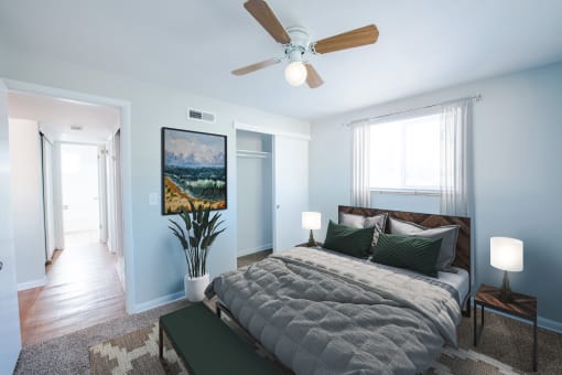Bedroom with light and overhead fan