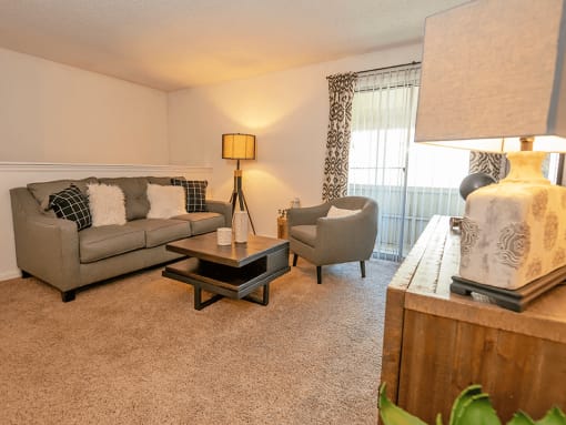 a living room with a couch and two chairs