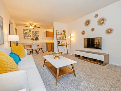 a living room with a couch coffee table and fireplace