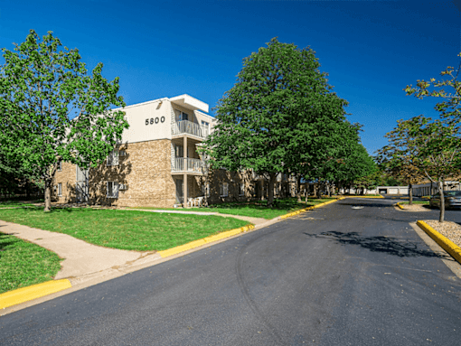 A street view of a residential building with the number 5800 on it.