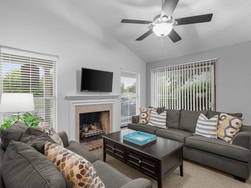 a living room with a couch and a tv