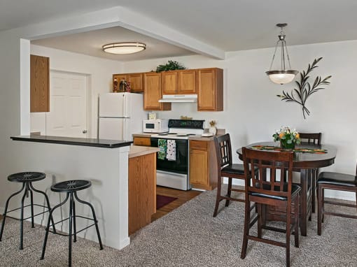 Beautiful open kitchen and dining area with breakfast bar in grand blanc, mi