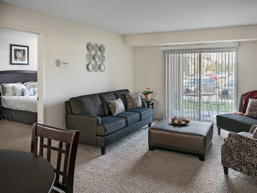 beautiful open living area with natural light and connected patio in grand blanc, mi