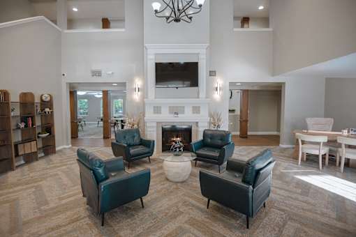 A living room with a fireplace and a couch.