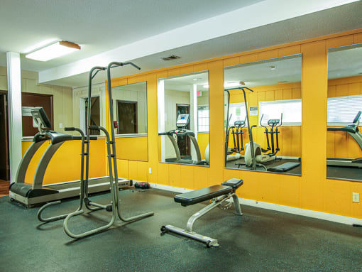 a gym with cardio equipment at apartment complex