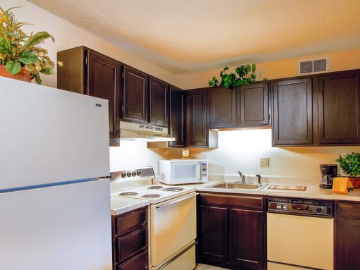 kitchen at greenmar apartments with dishwasher