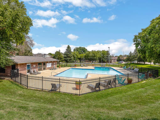 the swimming pool at our apartments with a fence around it