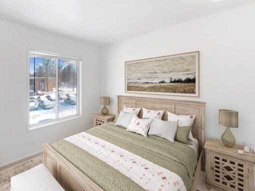 a bedroom with a large bed and a large window