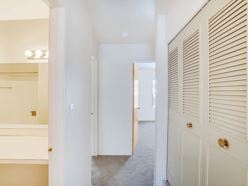 a bedroom with a closet and a hallway