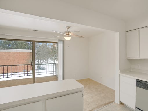 a kitchen and dining area overlooking a private balcony