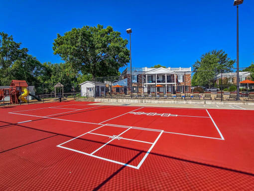 multi sport court with clubhouse in the background