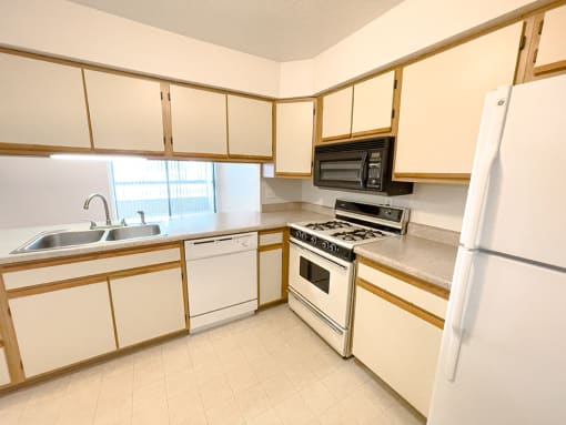 apartment kitchen with dishwasher and microwave 