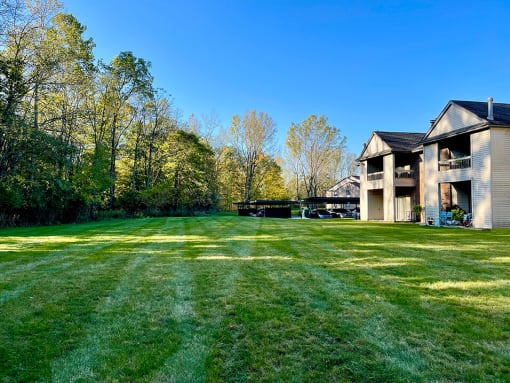 open green area outside apartments at huntington glen