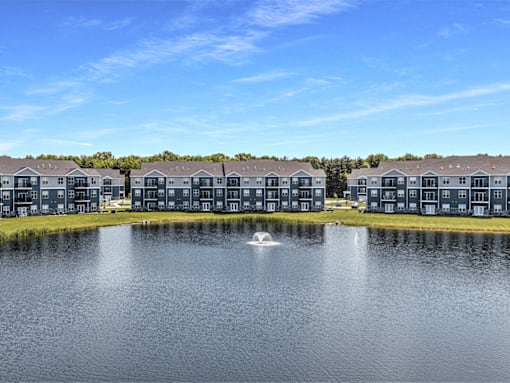 A row of houses are built on a lake.