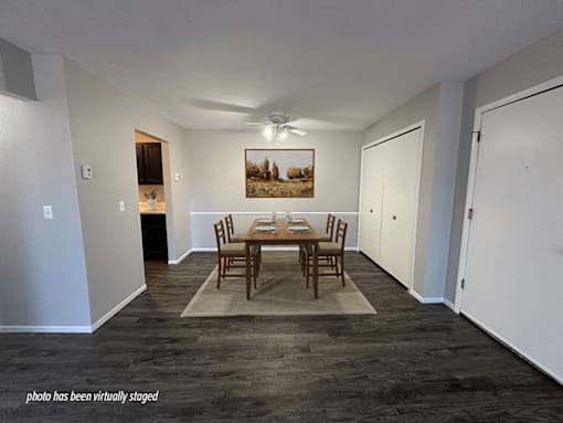 Apartment dining area with hardwood style flooring