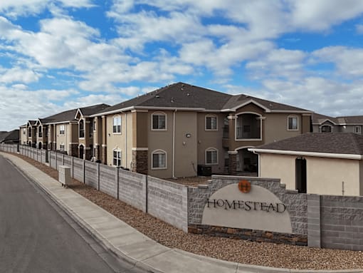 A row of houses with a sign that says