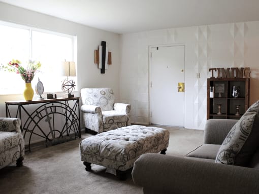 apartment living room with couch and chairs