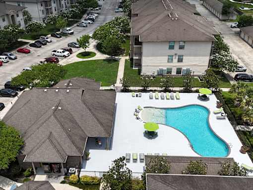 A bird's eye view of a house with a pool in the backyard.