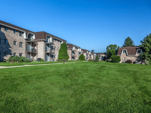 exterior of lamberton lake apartments with lots of green area