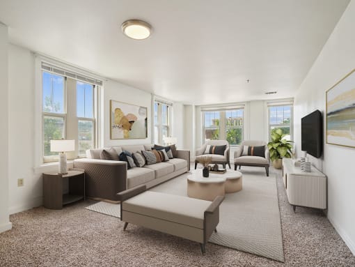 living room of an apartment with couch and chairs