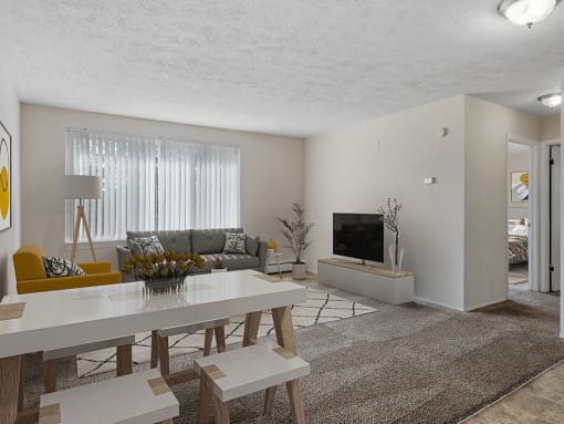 a living room with a white table and couch