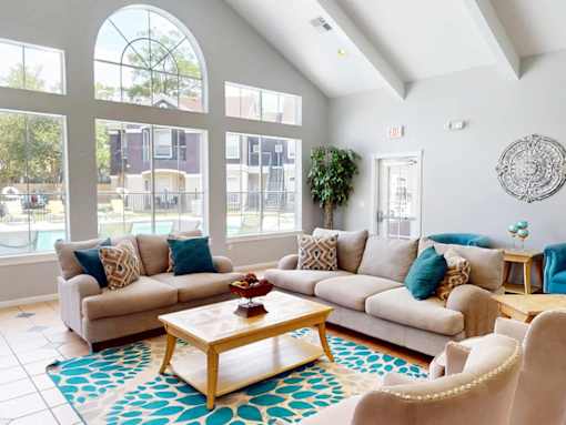 A living room with a large couch and a coffee table.