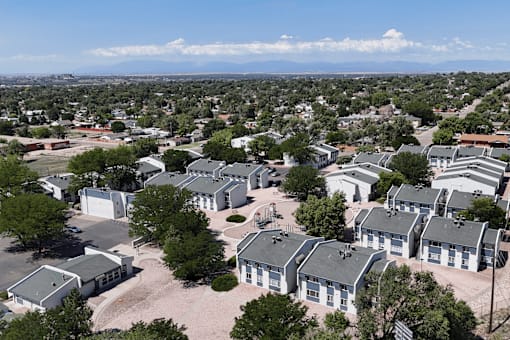 A bird's eye view of a residential area with houses and trees.