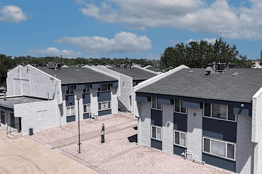 A row of houses with grey and white exteriors.