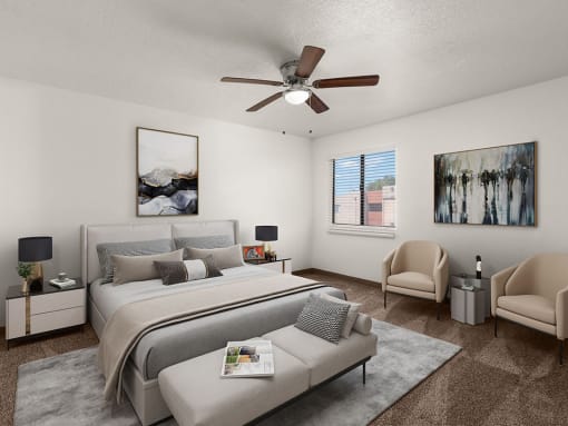 a bedroom with a large bed and a ceiling fan