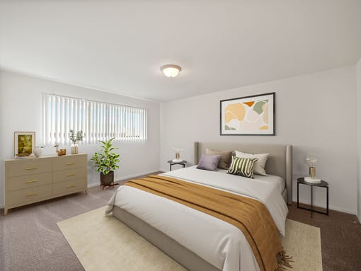 Bedroom with large window at miller west apartments