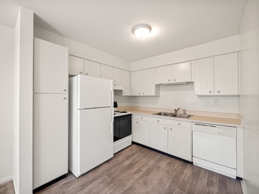 large kitchen with pantry and storage space at miller west apartments